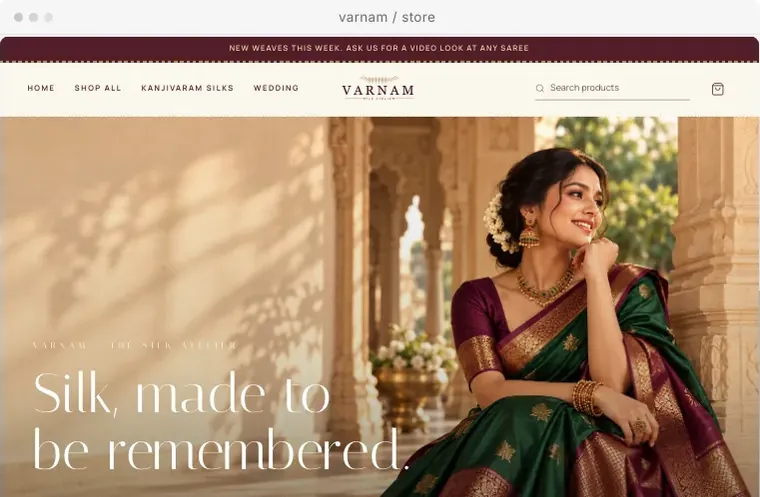 The Varnam store design for silk sarees, in ivory, wine and gold.