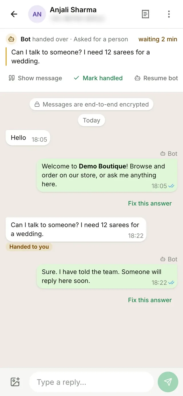 A chat in the WazBuy app on a phone. The top card says the bot handed over because the buyer asked for a person, with Mark handled and Resume bot buttons.